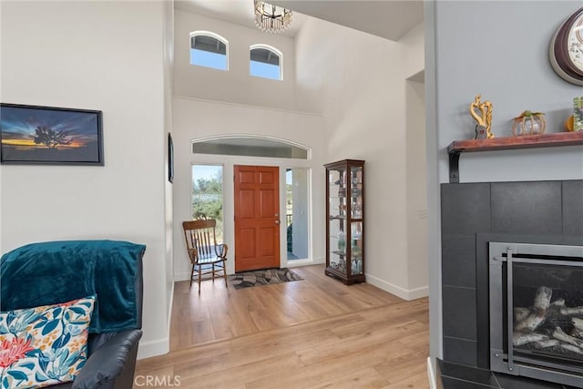 4620 Sandpiper Ln, Paradise, CA 95969 - foyer with light wood-style floors, a fireplace, and a high ceiling