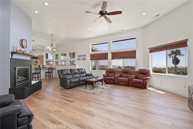 4620 Sandpiper Ln, Paradise, CA 95969 - living area with plenty of natural light, a high ceiling, recessed lighting, ceiling fan, and light wood finished floors