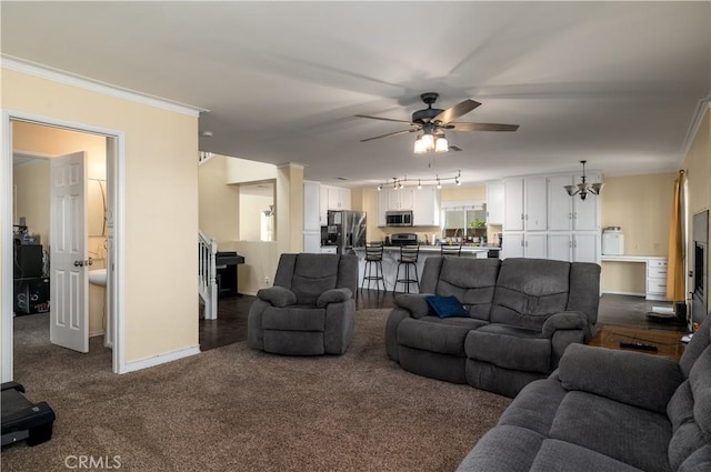 1649 Wrentree Way, Hemet, CA 92545 - living area with a ceiling fan, carpet flooring, crown molding, and a chandelier