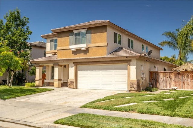1649 Wrentree Way, Hemet, CA 92545 - view of front of home featuring a garage, a tile roof, stucco siding, and driveway