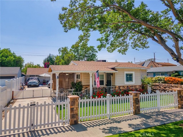 515 N Shelton St, Burbank, CA 91506 - single story home featuring covered porch, a fenced front yard, stone siding, and concrete driveway