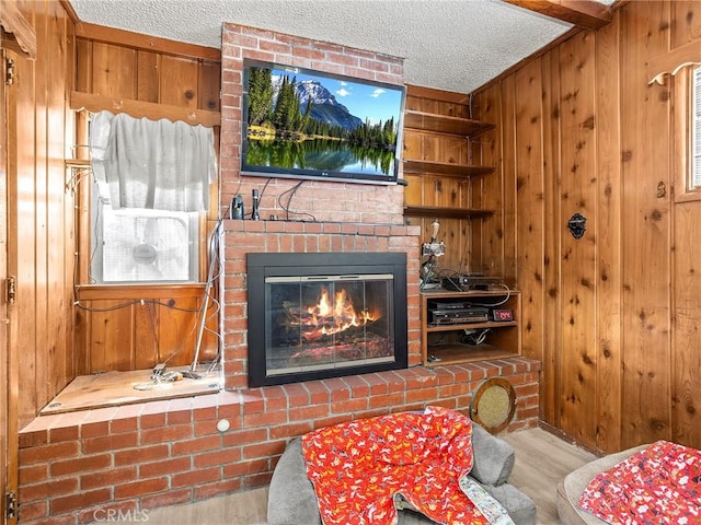 515 N Shelton St, Burbank, CA 91506 - detailed view of wooden walls, wood finished floors, a textured ceiling, and a brick fireplace