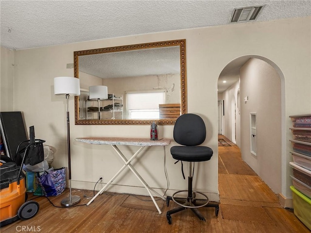 515 N Shelton St, Burbank, CA 91506 - dining space with a textured ceiling, wood finished floors, and arched walkways