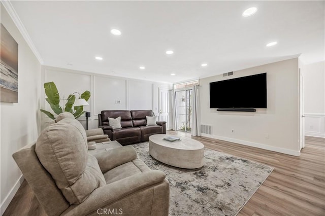 29282 Rue Cerise Unit 7, Laguna Niguel, CA 92677 - living area featuring light wood-type flooring, crown molding, and recessed lighting