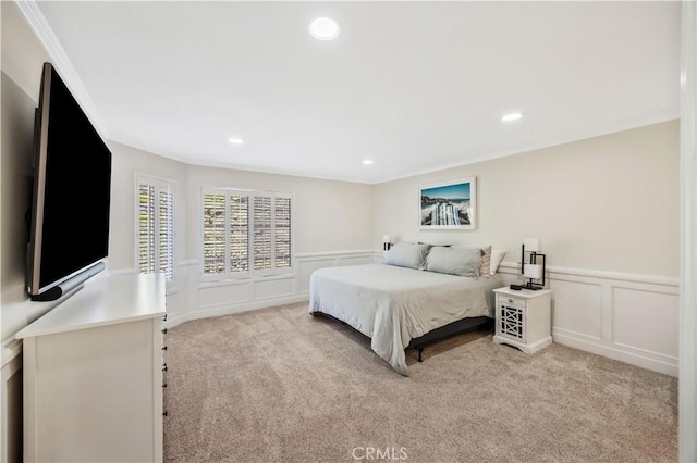 29282 Rue Cerise Unit 7, Laguna Niguel, CA 92677 - bedroom featuring a decorative wall, light colored carpet, ornamental molding, wainscoting, and recessed lighting