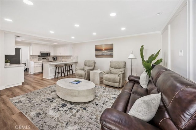 29282 Rue Cerise Unit 7, Laguna Niguel, CA 92677 - living area with light wood-style floors, recessed lighting, and crown molding