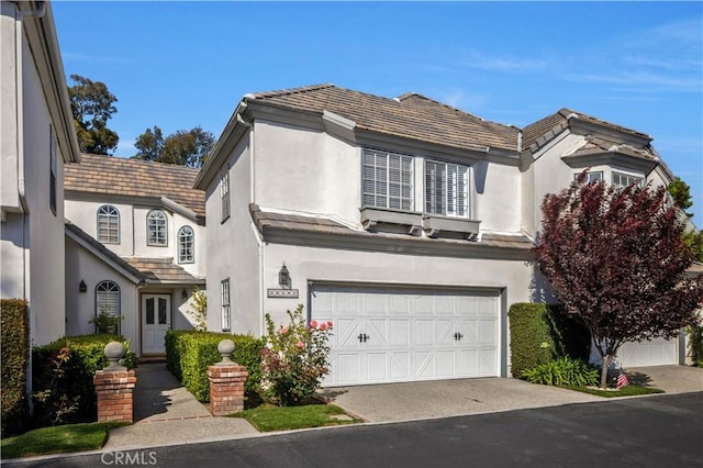 29282 Rue Cerise Unit 7, Laguna Niguel, CA 92677 - view of front facade with stucco siding, an attached garage, and a tile roof