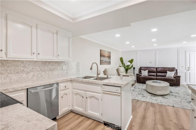 29282 Rue Cerise Unit 7, Laguna Niguel, CA 92677 - kitchen featuring stainless steel dishwasher, crown molding, light wood-style flooring, a peninsula, and white cabinetry