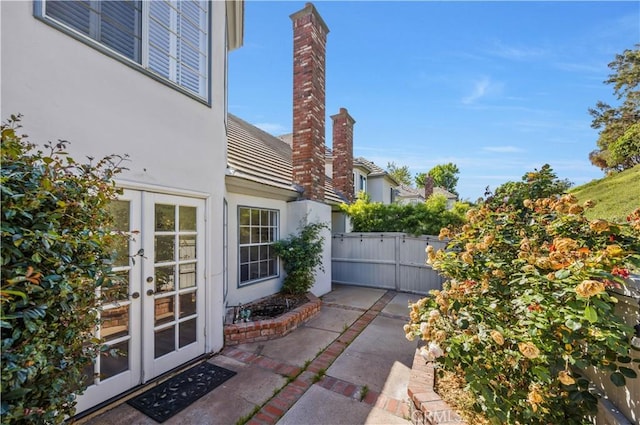 29282 Rue Cerise Unit 7, Laguna Niguel, CA 92677 - view of patio / terrace featuring french doors and a gate