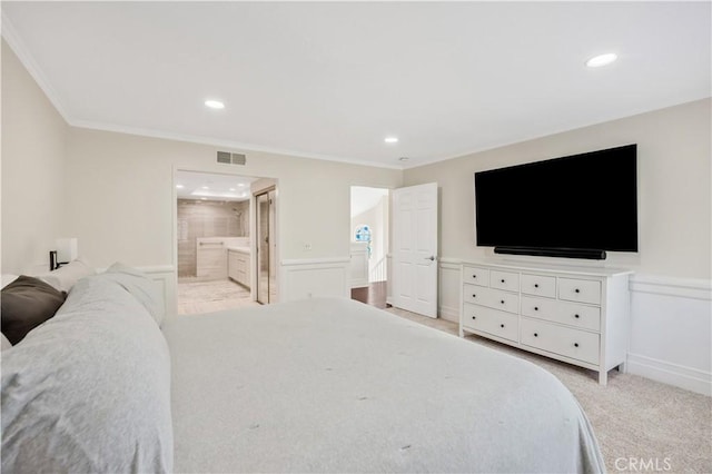 29282 Rue Cerise Unit 7, Laguna Niguel, CA 92677 - bedroom with crown molding, recessed lighting, wainscoting, ensuite bathroom, and carpet flooring