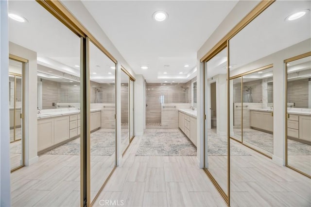 29282 Rue Cerise Unit 7, Laguna Niguel, CA 92677 - full bathroom with two vanities, recessed lighting, and a shower stall