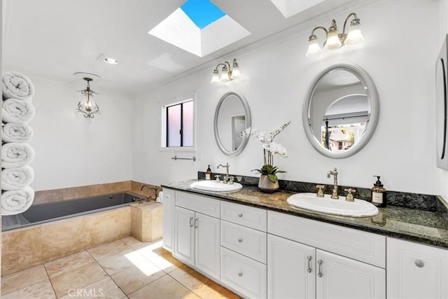 210 W Avenida Gaviota, San Clemente, CA 92672 - full bathroom with a skylight, double vanity, a garden tub, ornamental molding, and tile patterned flooring