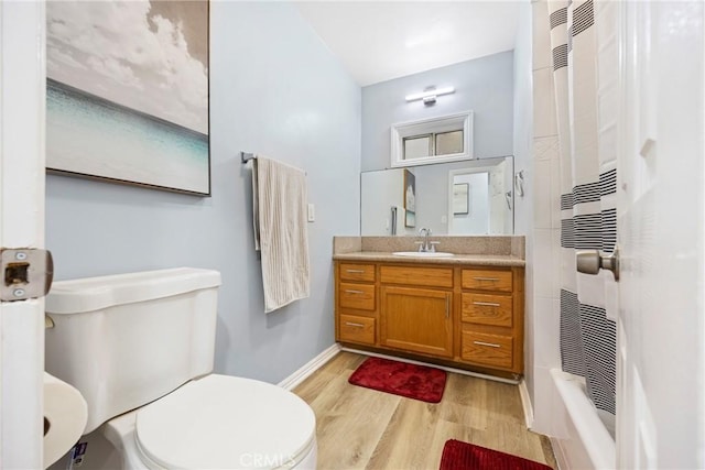 107 E Johnson St, Compton, CA 90220 - bathroom featuring wood finished floors, vanity, curtained shower, and a heating unit