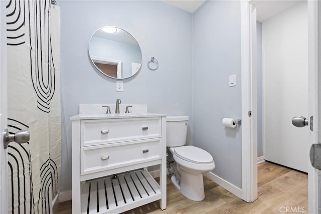 107 E Johnson St, Compton, CA 90220 - bathroom with wood finished floors, vanity, and a shower with shower curtain