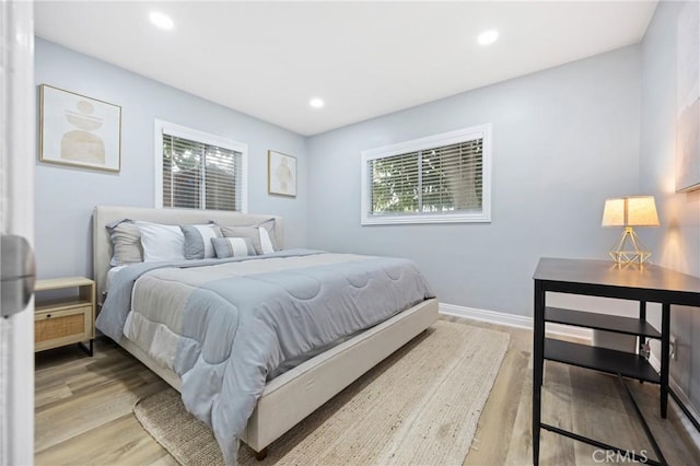 107 E Johnson St, Compton, CA 90220 - bedroom featuring wood finished floors, multiple windows, and recessed lighting