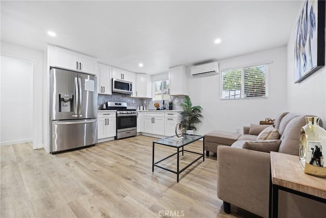 107 E Johnson St, Compton, CA 90220 - living area featuring a wall mounted AC, light wood finished floors, and recessed lighting