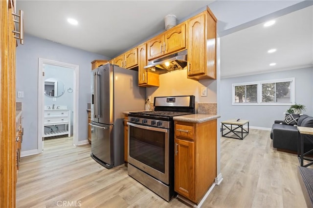 107 E Johnson St, Compton, CA 90220 - kitchen featuring appliances with stainless steel finishes, under cabinet range hood, light wood-type flooring, recessed lighting, and light countertops