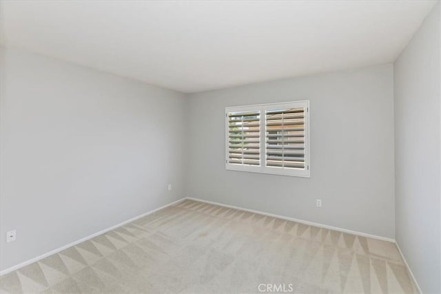 6701 Whitewater St, Eastvale, CA 91752 - spare room featuring light carpet and baseboards