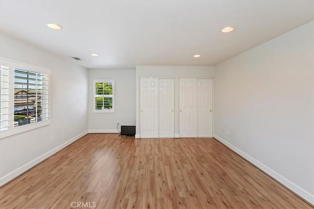 6701 Whitewater St, Eastvale, CA 91752 - unfurnished bedroom featuring two closets, light wood-style floors, and recessed lighting