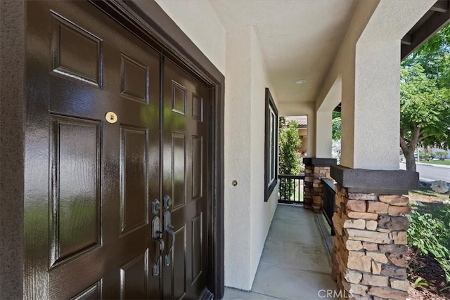 6701 Whitewater St, Eastvale, CA 91752 - property entrance with a porch and stucco siding