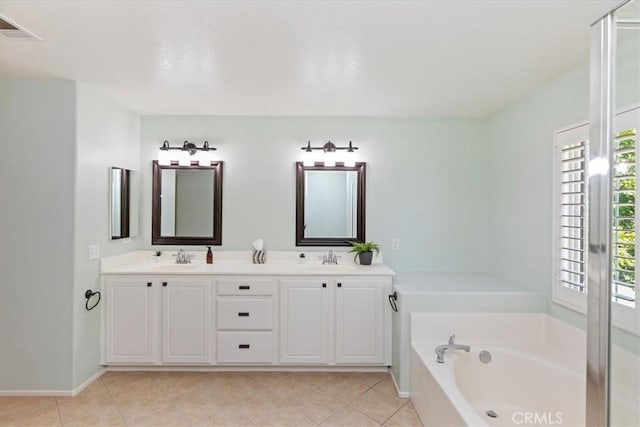 6701 Whitewater St, Eastvale, CA 91752 - bathroom with plenty of natural light, a bath, double vanity, and tile patterned flooring