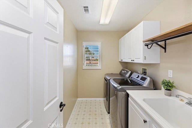 6701 Whitewater St, Eastvale, CA 91752 - laundry area featuring washer and dryer, cabinet space, and light floors