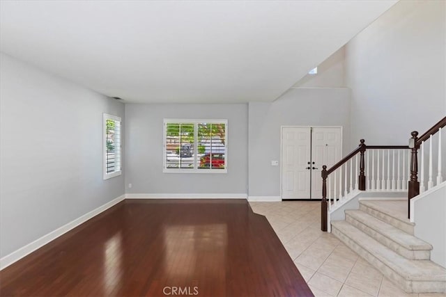 6701 Whitewater St, Eastvale, CA 91752 - entrance foyer featuring stairway and wood finished floors