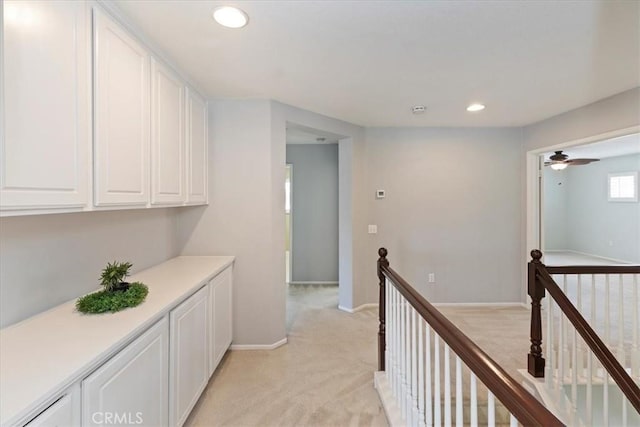 6701 Whitewater St, Eastvale, CA 91752 - hall with an upstairs landing, light colored carpet, and recessed lighting