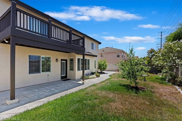 6701 Whitewater St, Eastvale, CA 91752 - rear view of property with stucco siding and a patio area
