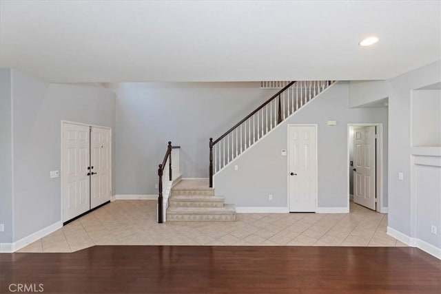 6701 Whitewater St, Eastvale, CA 91752 - entryway featuring stairway, light tile patterned flooring, and recessed lighting