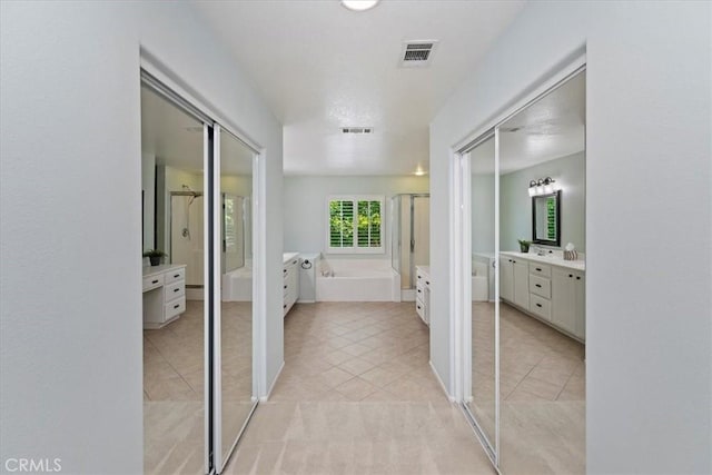 6701 Whitewater St, Eastvale, CA 91752 - hallway with light tile patterned floors