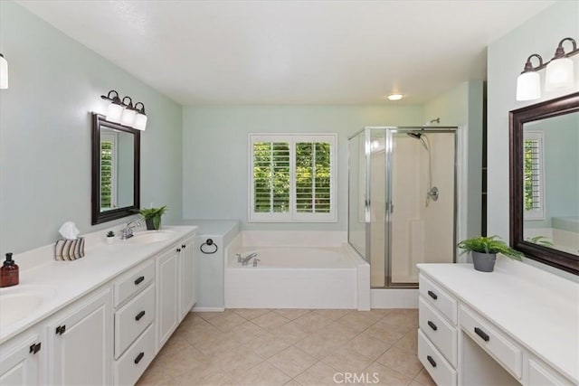 6701 Whitewater St, Eastvale, CA 91752 - bathroom featuring double vanity, a garden tub, a stall shower, and tile patterned floors