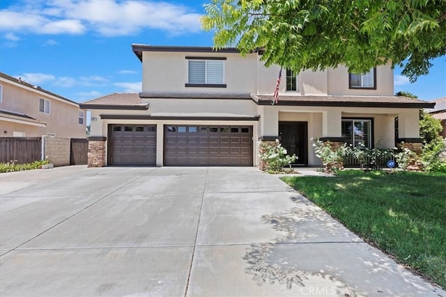 6701 Whitewater St, Eastvale, CA 91752 - traditional-style house with stucco siding, concrete driveway, an attached garage, and stone siding
