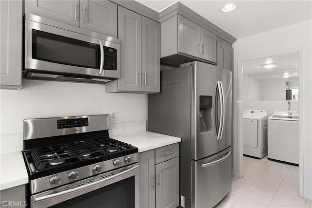 12746 Rosebrook Way, Stanton, CA 90680 - kitchen with appliances with stainless steel finishes, gray cabinetry, washer and clothes dryer, and recessed lighting