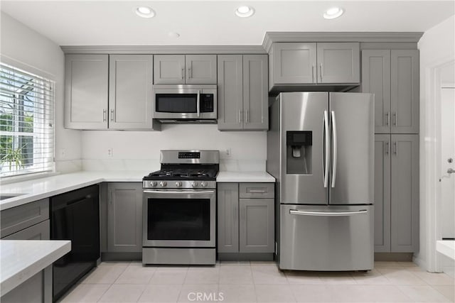 12746 Rosebrook Way, Stanton, CA 90680 - kitchen with appliances with stainless steel finishes, gray cabinets, light countertops, recessed lighting, and light tile patterned floors