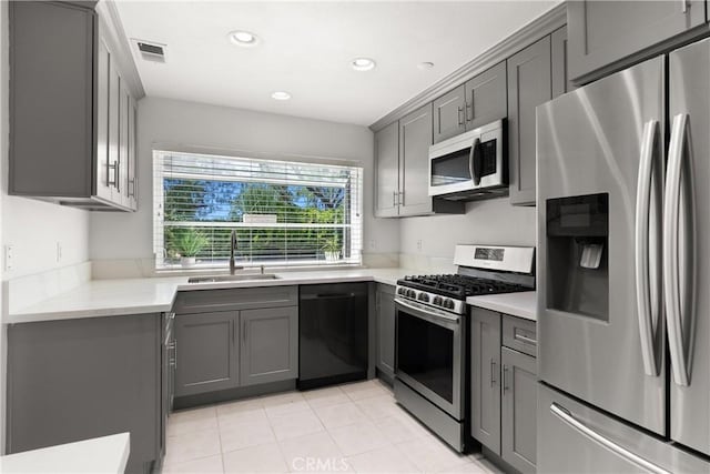 12746 Rosebrook Way, Stanton, CA 90680 - kitchen featuring appliances with stainless steel finishes, gray cabinets, recessed lighting, light countertops, and light tile patterned flooring