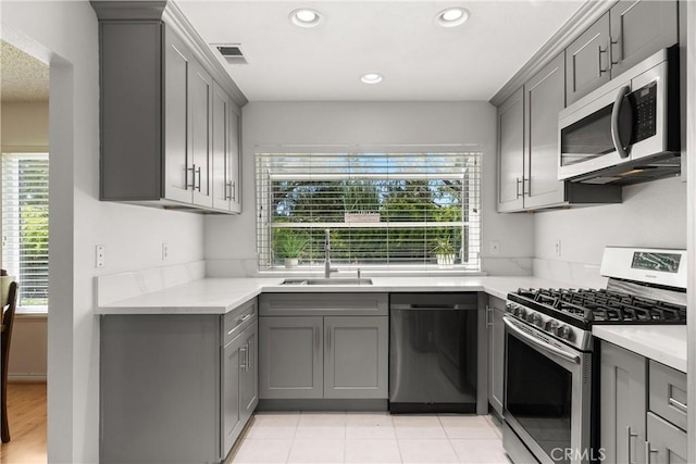 12746 Rosebrook Way, Stanton, CA 90680 - kitchen with appliances with stainless steel finishes, gray cabinets, light countertops, and recessed lighting