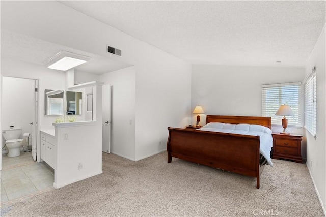 12746 Rosebrook Way, Stanton, CA 90680 - bedroom featuring a textured ceiling, light colored carpet, and ensuite bath