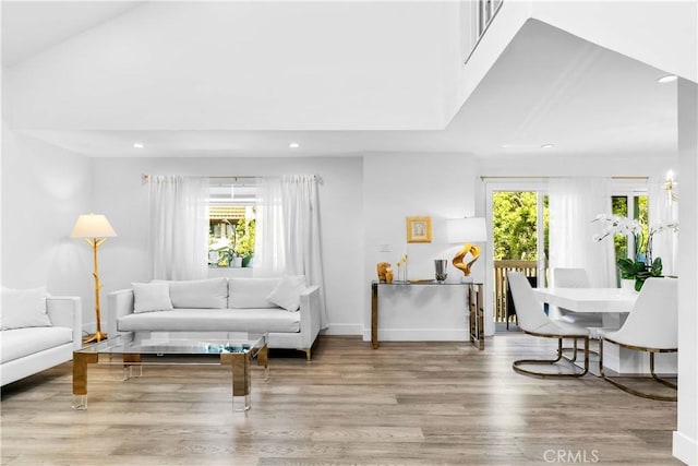 456 E San Jose Ave Unit C, Burbank, CA 91501 - living area with recessed lighting, healthy amount of natural light, wood finished floors, and lofted ceiling