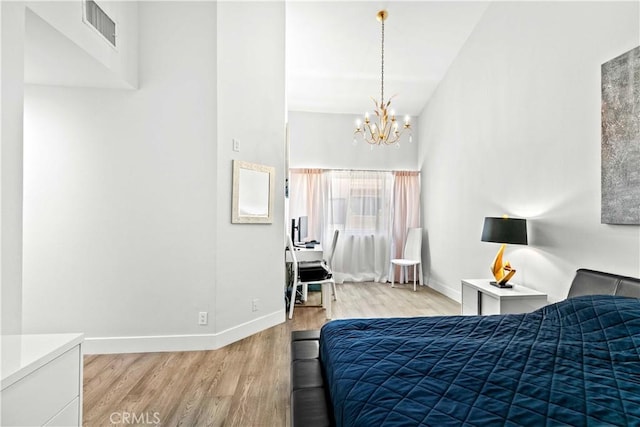 456 E San Jose Ave Unit C, Burbank, CA 91501 - bedroom with light wood-style floors and a chandelier