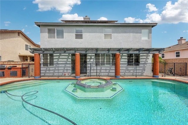 870 E Bermuda Dunes Ct, Ontario, CA 91761 - view of swimming pool with a pergola, a pool with connected hot tub, an outdoor kitchen, and a patio area