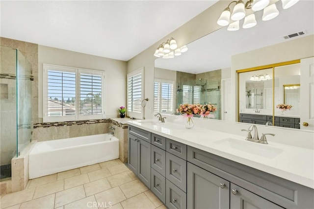 870 E Bermuda Dunes Ct, Ontario, CA 91761 - full bath with a chandelier, a shower stall, a bath, and double vanity