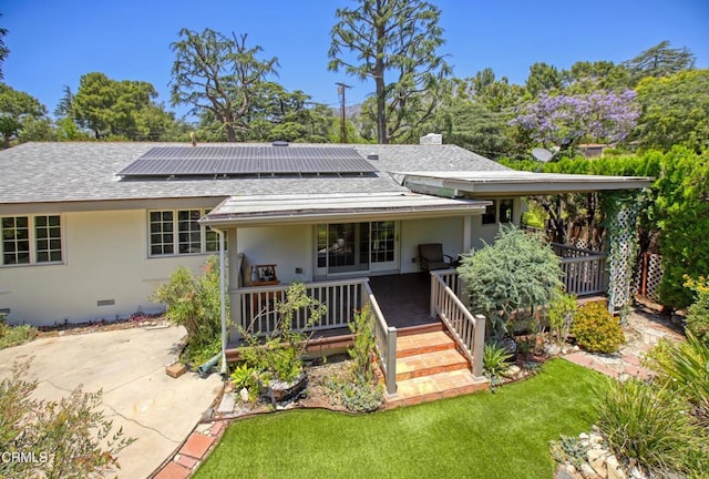 3628 El Caminito Ln, Crescenta, CA 91214 - view of front of home featuring solar panels, roof with shingles, stucco siding, and a front lawn