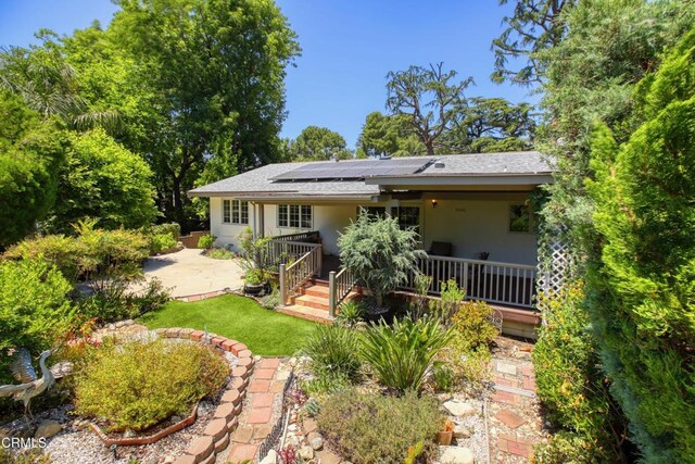 3628 El Caminito Ln, Crescenta, CA 91214 - back of property with solar panels, stucco siding, a shingled roof, and a patio area