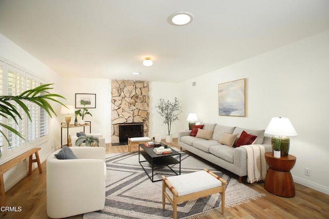 3628 El Caminito Ln, Crescenta, CA 91214 - living room featuring wood finished floors and a stone fireplace