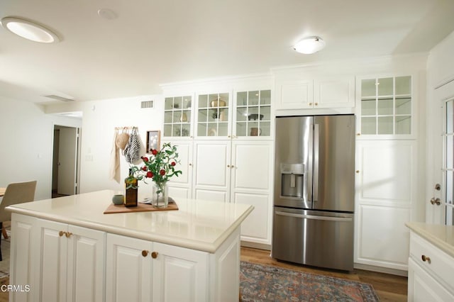 3628 El Caminito Ln, Crescenta, CA 91214 - kitchen with stainless steel fridge with ice dispenser, dark wood-style flooring, glass insert cabinets, white cabinets, and light countertops
