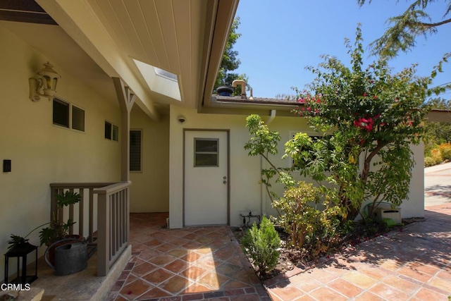 3628 El Caminito Ln, Crescenta, CA 91214 - view of exterior entry with stucco siding and a patio area
