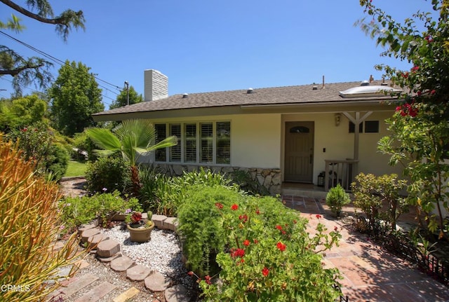 3628 El Caminito Ln, Crescenta, CA 91214 - view of front of home featuring stucco siding, stone siding, and a chimney
