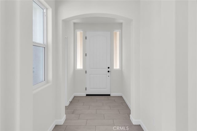 7444 Desert Sky Dr, Yucca Valley, CA 92284 - entrance foyer featuring arched walkways and baseboards
