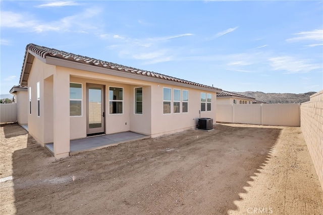 7444 Desert Sky Dr, Yucca Valley, CA 92284 - back of house featuring a fenced backyard, a tile roof, a patio area, and stucco siding